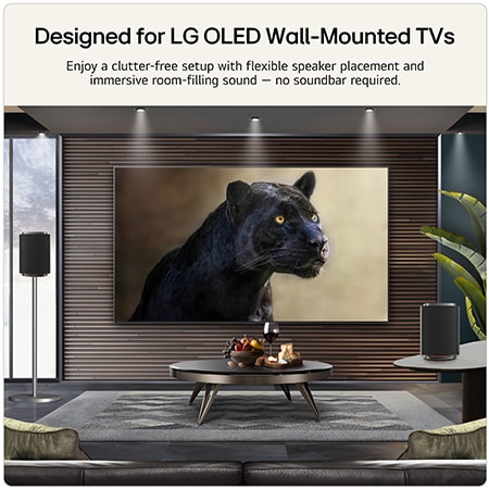 LG Stereo 7 wireless speakers positioned beside an LG OLED wall-mounted TV, delivering immersive room-filling audio in a modern living room